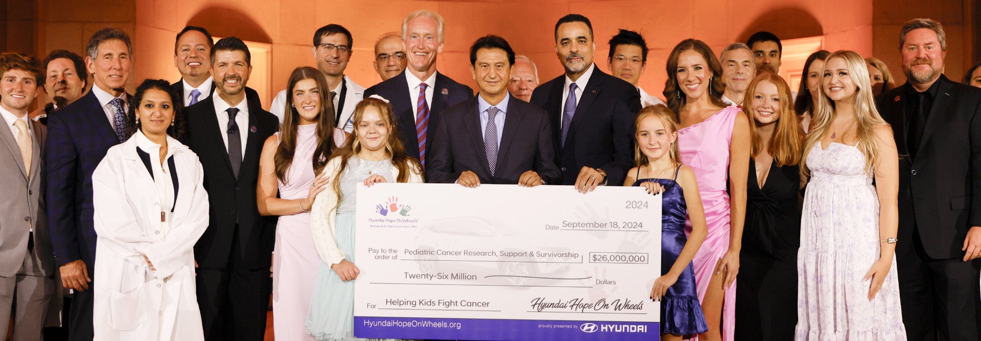 helping kids fight cancer foundation showing their big check from hyundai hope on wheels - Merced Hyundai in Merced CA